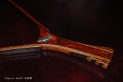 A beautiful rich cocobolo handle with a wenge edged mahogany hoop and an oak burl magnetic catch