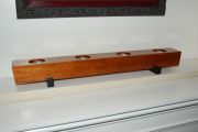 A candle holder made from pallet material, of an unknown tropical hardwood & Ebony