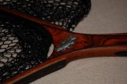 A beautiful rich cocobolo handle with a wenge edged mahogany hoop inlaid pewter brook trout 