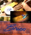 Hand carving the Client's Logo in a Custom Curly Claro Walnut Net by Sierra Nets