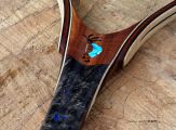 A custom Kokopelli in Silver, Kingman Turquoise, Anthracite, & Lava Rock 