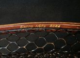 Permanent hand-carved brass inlays inside the hoop