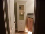 A Bathroom Storage Cabinet and A Custom Maple Corner Vanity